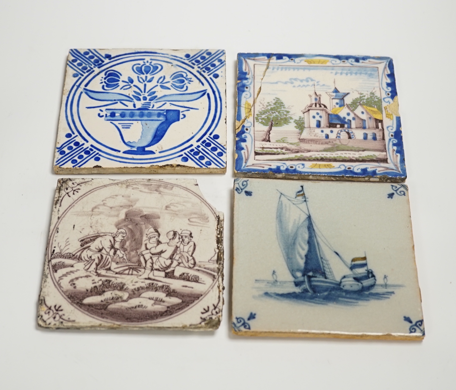 A group of Delft tiles including two polychrome examples and three decorated with ships, 18th/19th century, approximately 12.5cm x 12.5cm (a.f.)